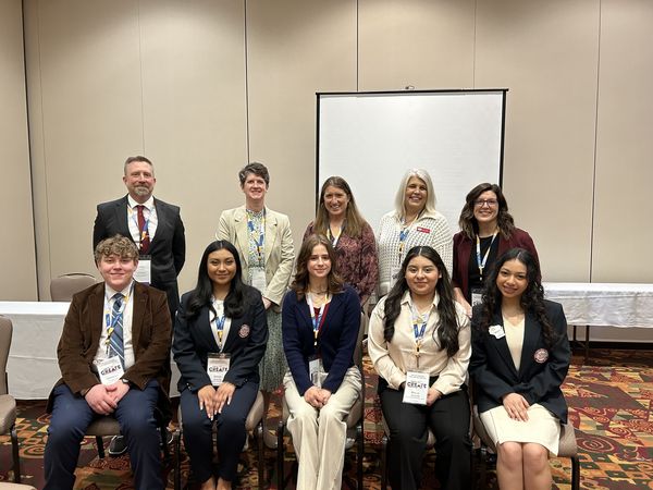 Dr. Jill Underly (center, back) poses with health occupations students and their teachers at the April 2024 Wisconsin Leadership conference in Madison.