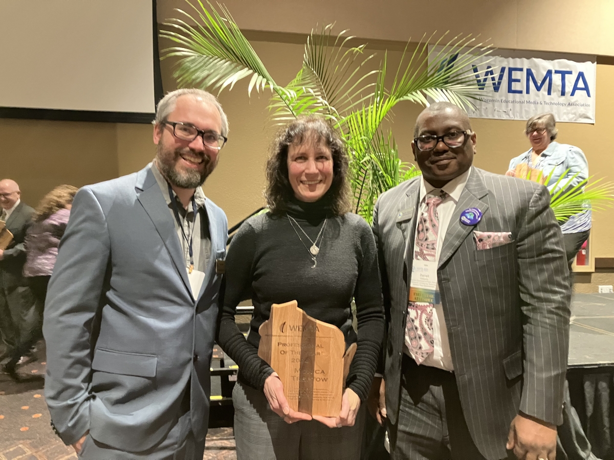 Monica Treptow (center), DPI's School Library Media Consultant, is the 2024 recipient of the WEMTA Professional of the Year Award.  Monica is flanked by (left) Ben Miller, Director of Library Services, and (right) Dr. Darrell Williams, Assistant State Superintendent Division for Libraries and Technology.