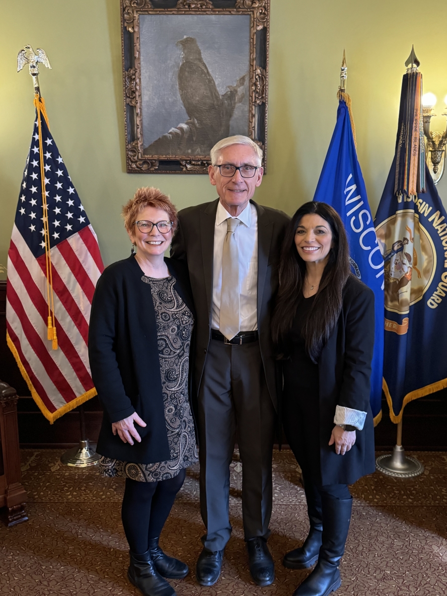 School Nurse and Health Services Consultant Louise Wilson poses for a photograph with Wisconsin Governor Tony Evers and Susan Piazza, Director of the Student Services, Prevention and Wellness Team 