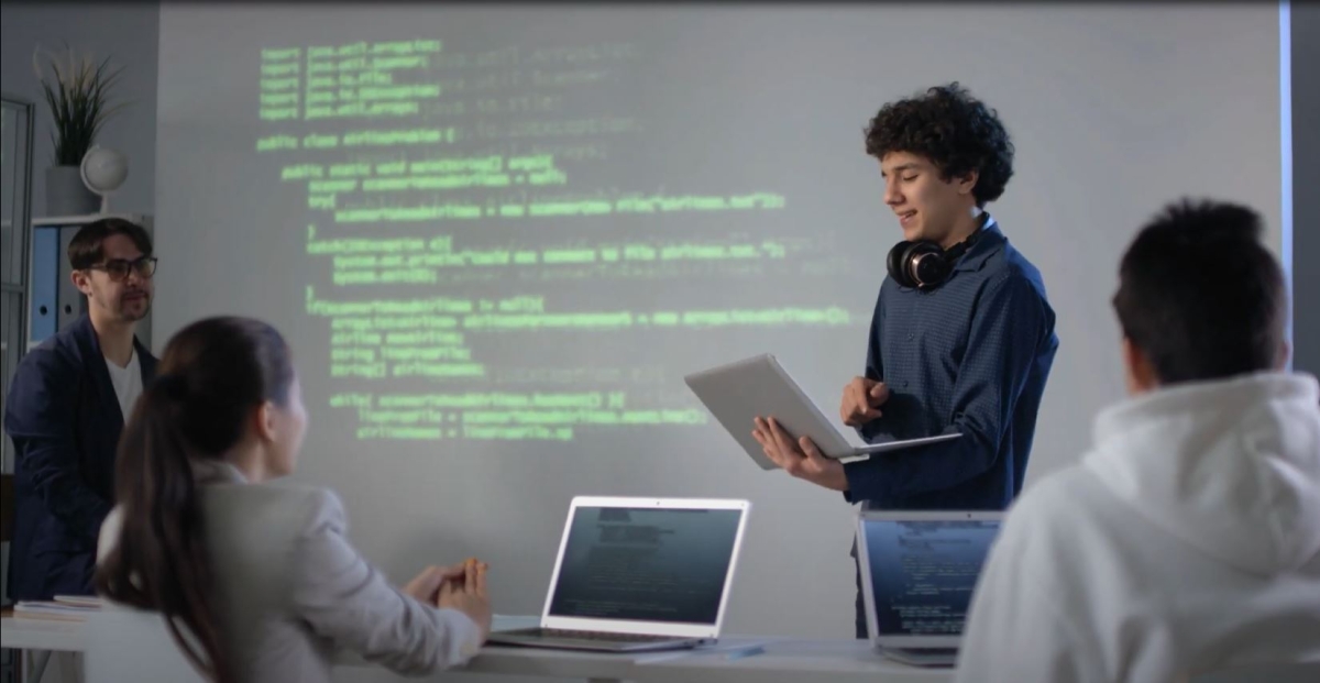 Student leading computer presentation