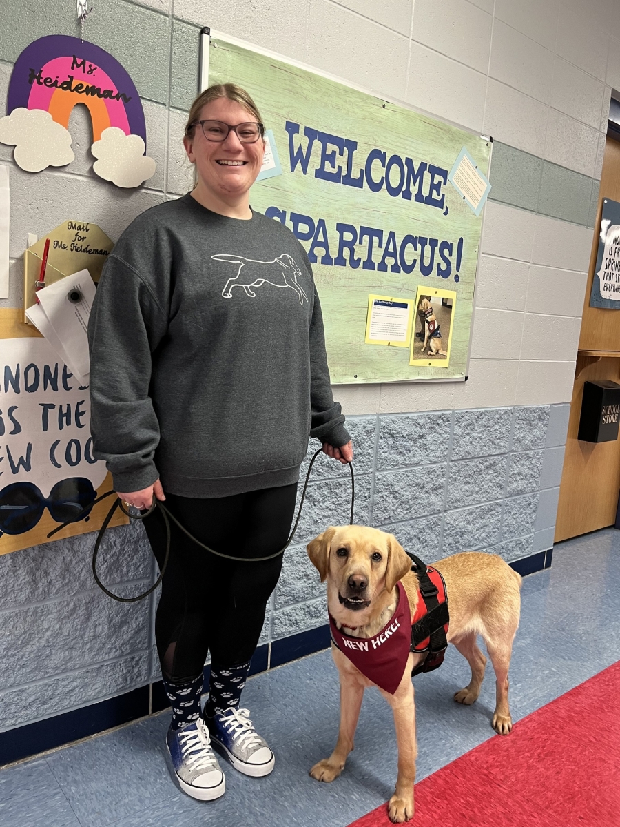 School counselor Kaelee Heideman poses with her English lab pup, Spartacus