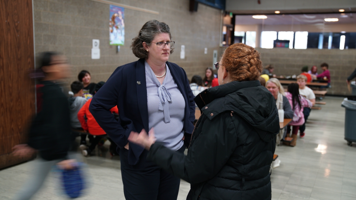 State Superintendent Dr. Underly speaks with a parent.