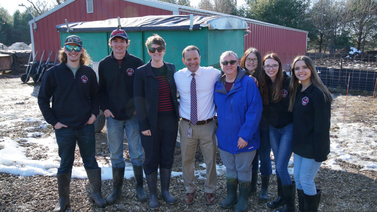 Dr. Jill Underly visits the agricultural stables of the New Richmond high school CTE program.