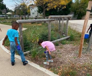 Students from Hawthorne Elementary School’s after school Green Team Club participate in weekly trash pick-ups on the school grounds in Milwaukee, Wisconsin.