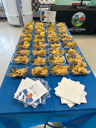 Students get to taste the fruits of their labor. On the table are individual serving containers of tortilla chips along with "Parkside Pico," a salsa made from the fresh ingredients the students grew themselves.