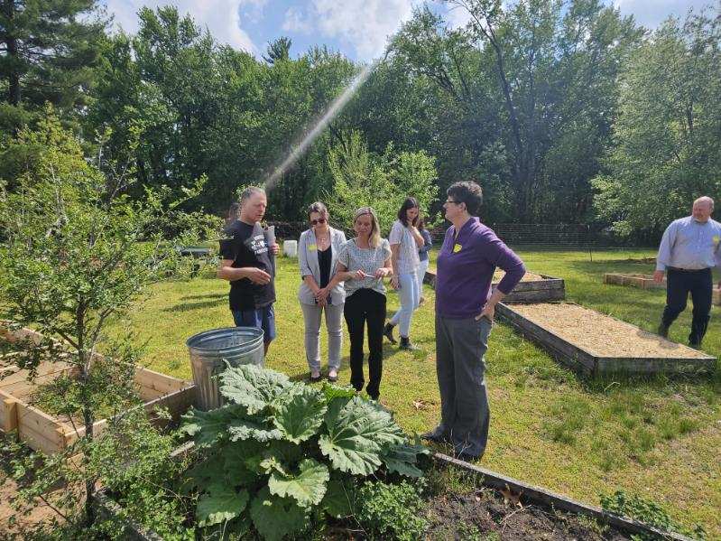 Dr. Underly views the raised beds in the Montello schools garden