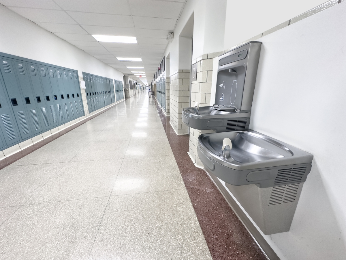 Two water fountains in a school hallway 
