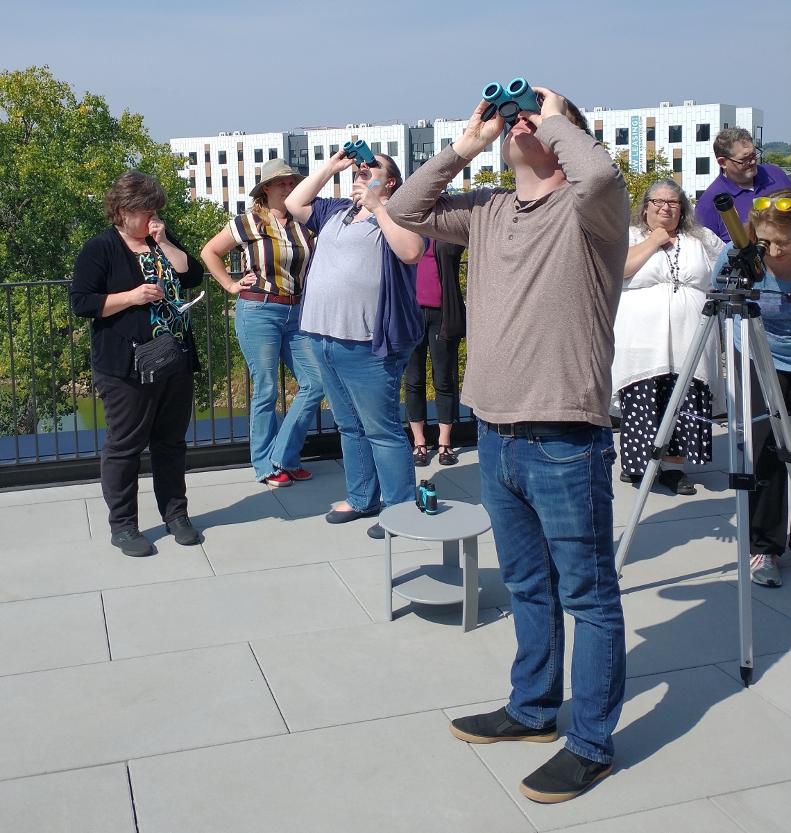 SEAL workshop attendees looking through binoculars