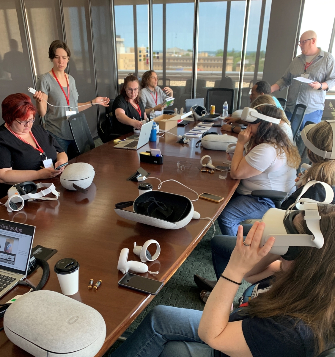 Librarians testing VR headsets in a conference room