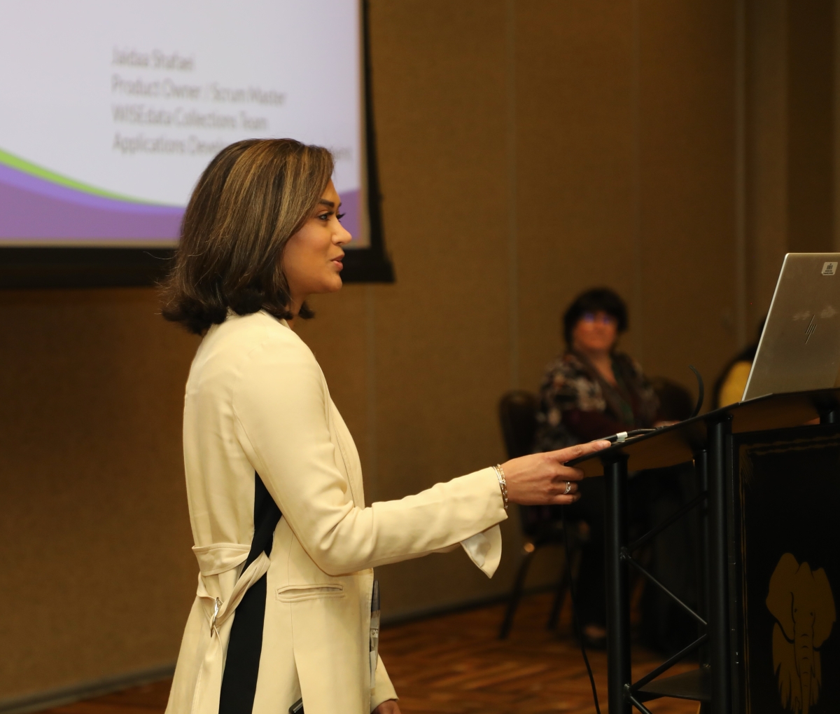 Jaidaa serves her audience with a smile during a presentation at the 8th annual WISEdata Conference. 