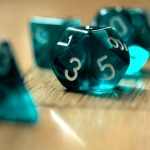 Blue-green 9-sided dice